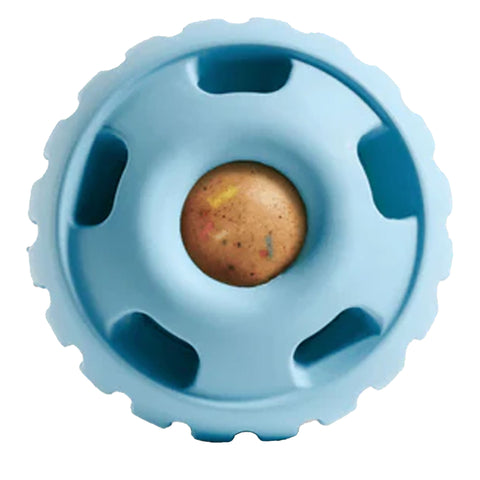 Blue plastic toy with a brown treat in cetner on a white background